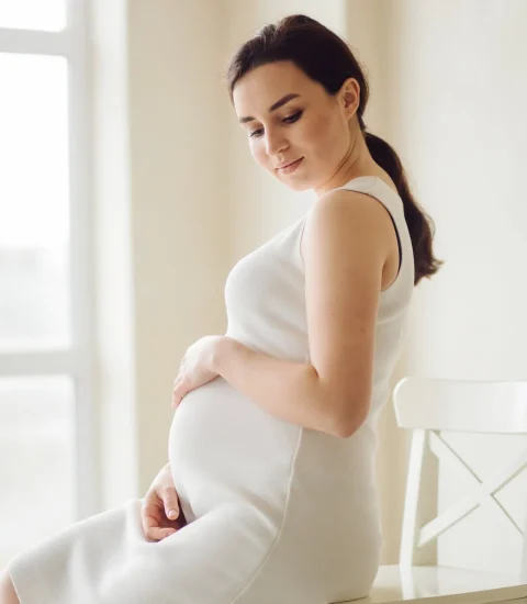 beautiful-young-pregnant-woman-posing-studio-dress