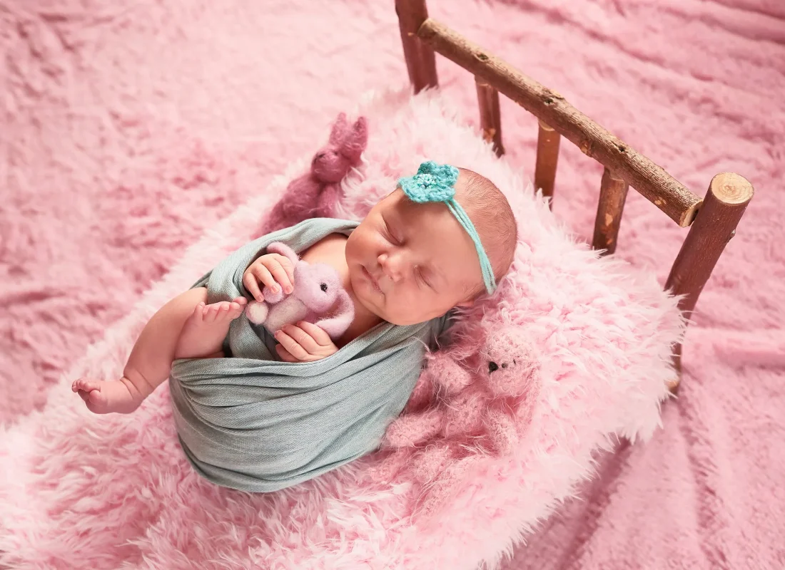 small-child-lies-bed-with-toys